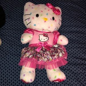 3 very well loved build a bears. 1 ty hello kitty